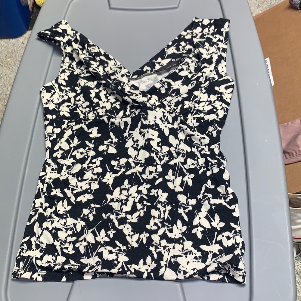 Black and and cream tank top with flower pattern on it from the brand limited
